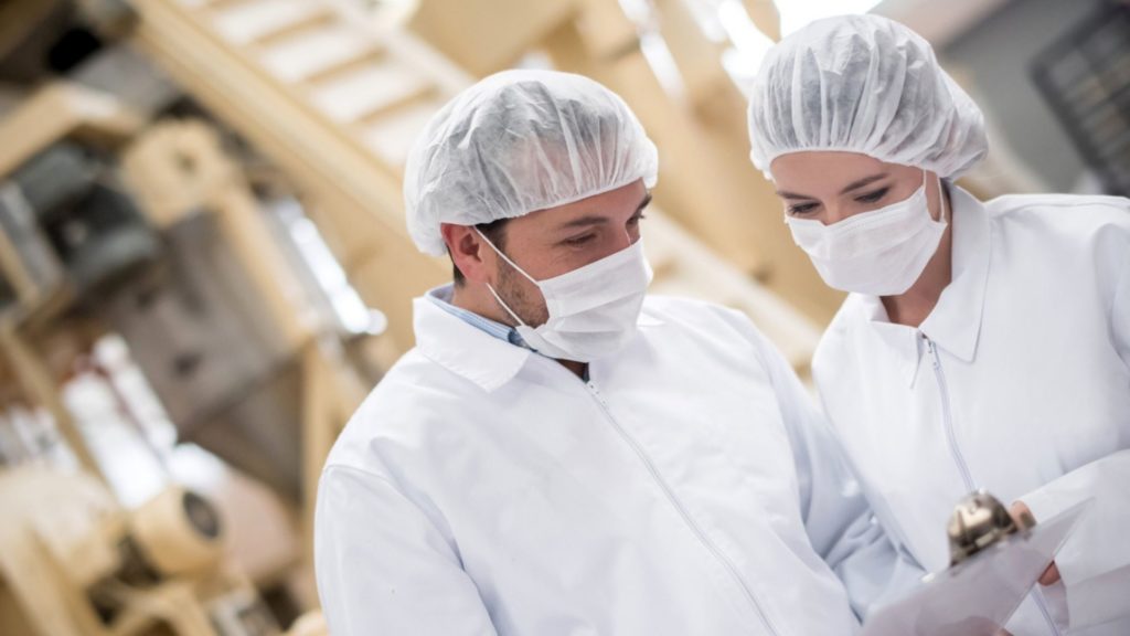 two workers enjoying their job in Ontario’s Food and Beverage Processing Industry